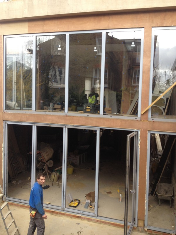 Aluminium bi-fold doors with two-storey glazing in St John's Wood